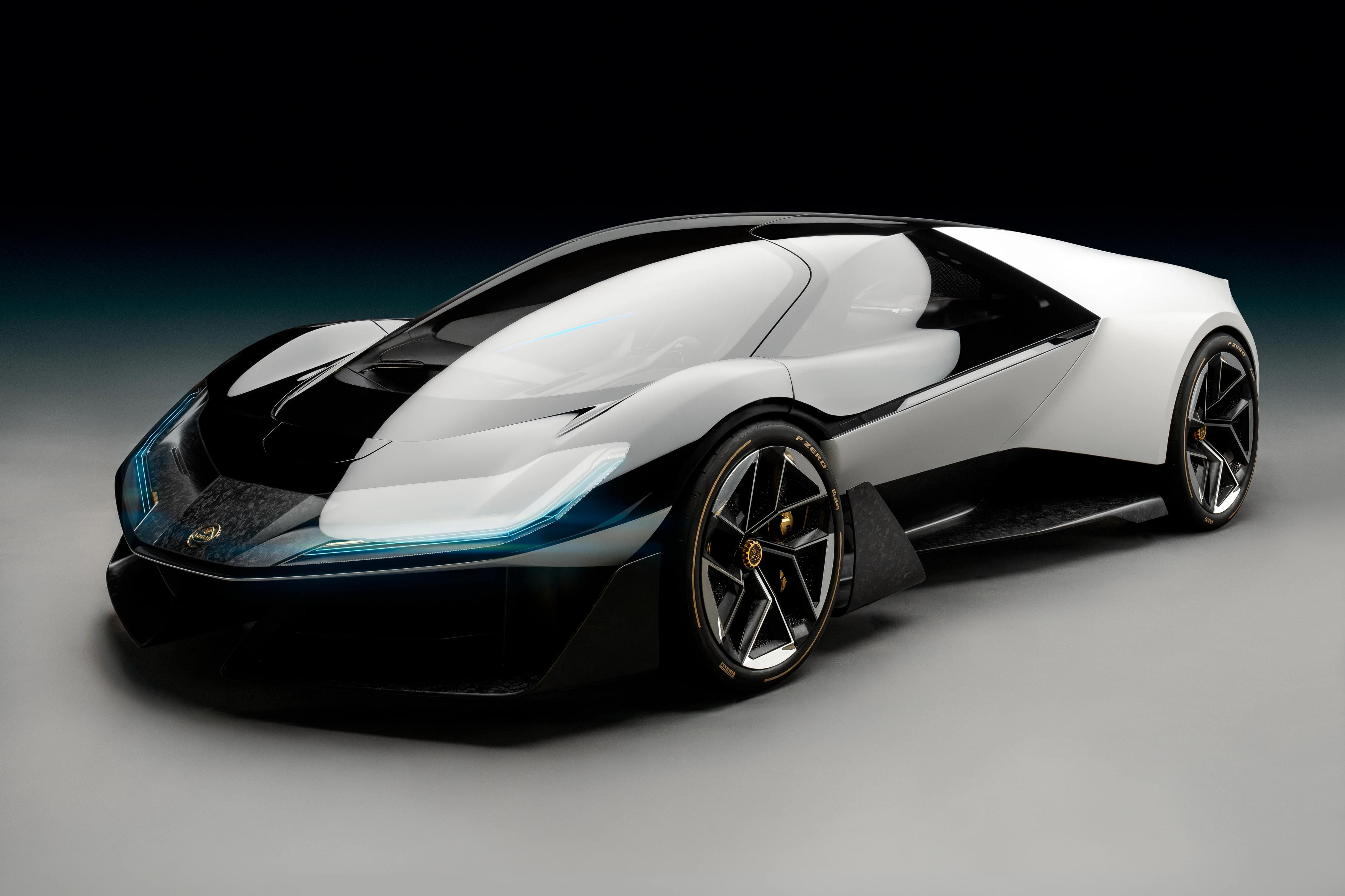 Black-and-white Lotus Theory 1 concept car in a low three-quarter studio view, with its blue front light illuminated.