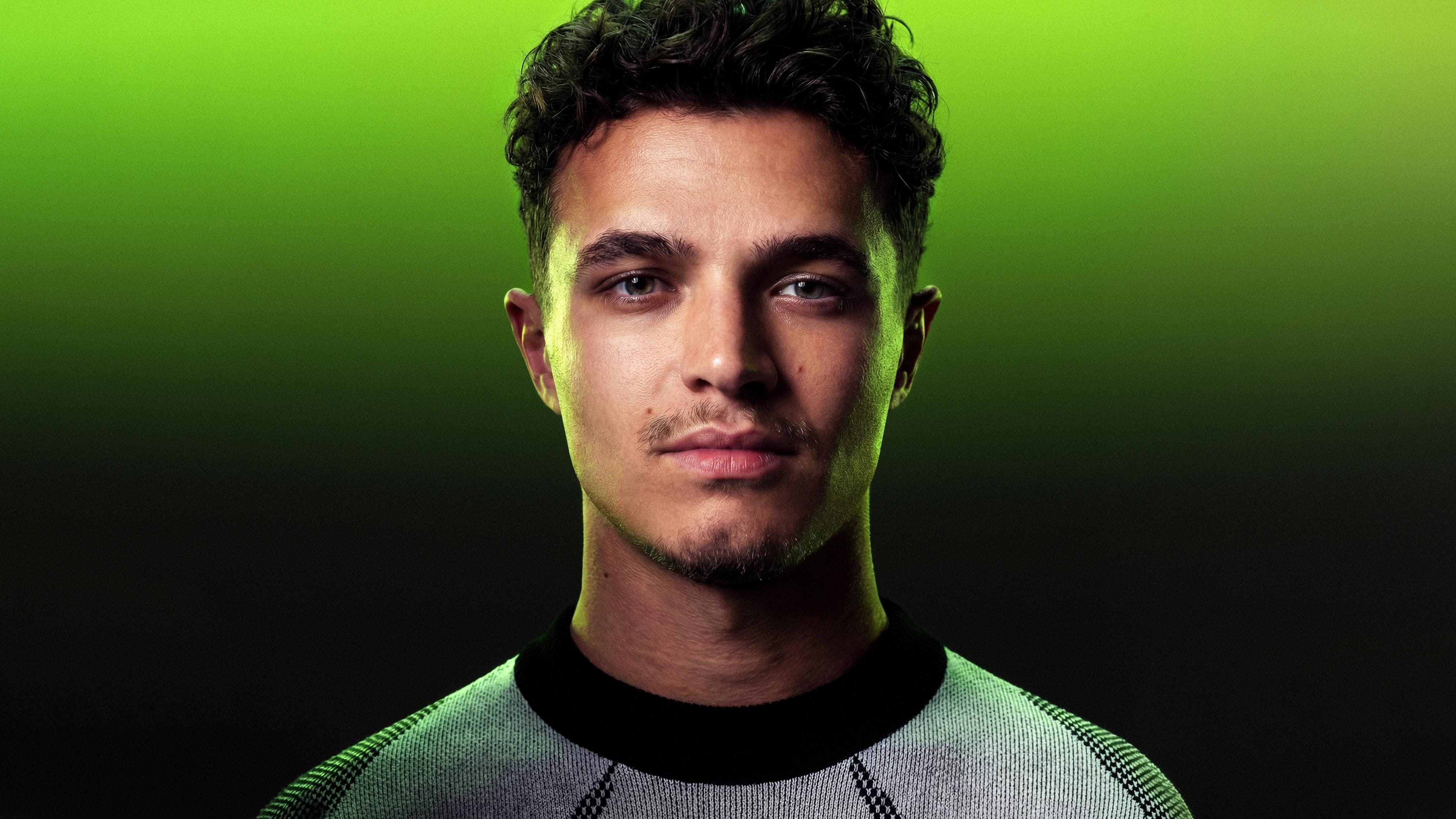 Close portrait of Lando Norris against an acid-green-to-black gradient for the global launch of his Monster Energy collaboration drink.