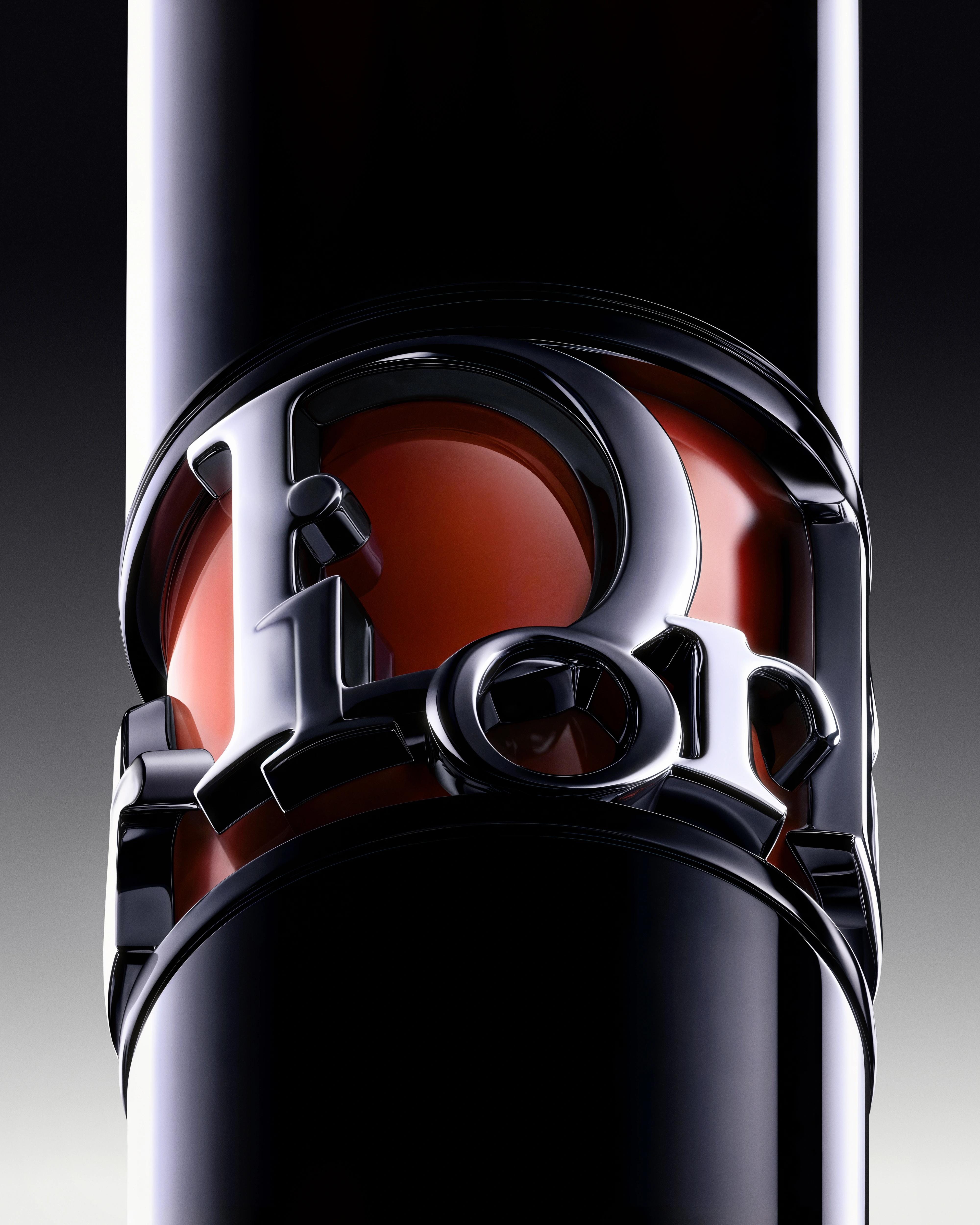 Dior Diorshow Iconic Overcurl mascara standing upright, its silver lettering wrapped around a translucent red case against black.