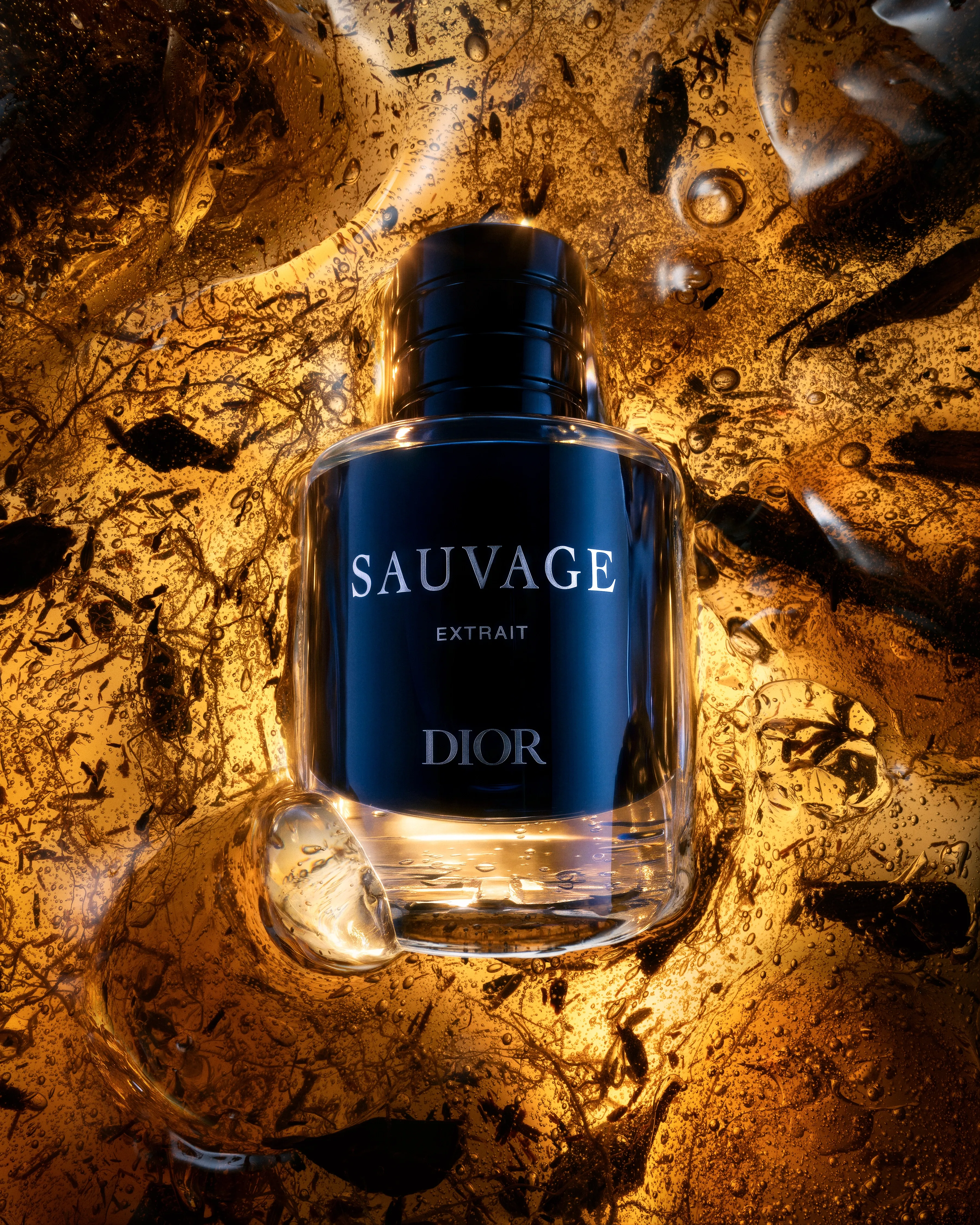 Dior Sauvage Extrait bottle suspended within translucent amber material, real oud and botanical fragments, illuminated from behind.