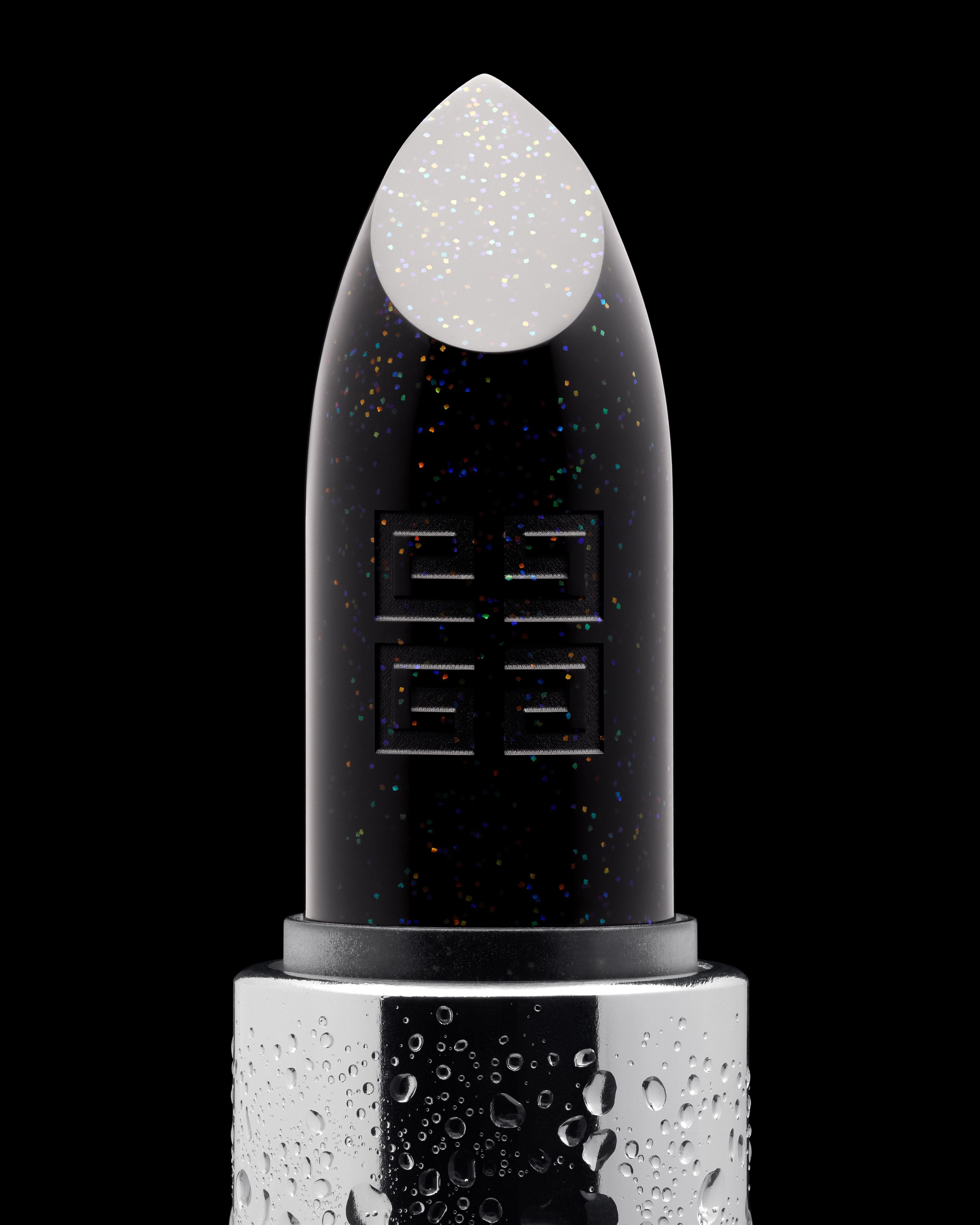 Givenchy Le Rouge Interdit white lip balm covered with fine droplets, rising from a silver case against black.
